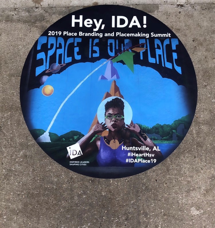 Ad for the IDA conference in Huntsville showing a mural at Campus No. 805