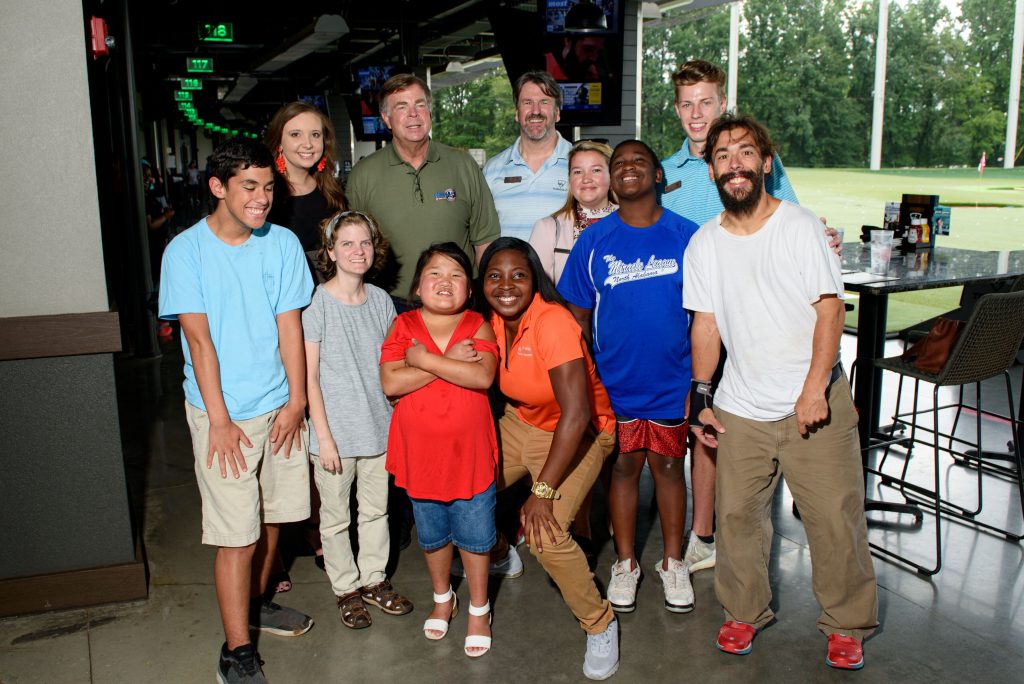 Photo of mayor battle and special populations participants smiling at Top Golf