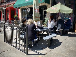 A group of diners enjoy lunch outdoors on the North side of the Downtown Square in Huntsville.