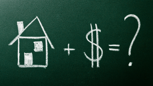 A graphic with a chalkboard background with a house, plus sign, dollar sign, equals sign and a question mark.
