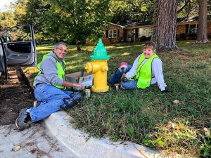 Green Team volunteers paint fire hydrant
