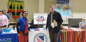 Flora E. Tapia-Johnson and Huntsville Mayor Tommy Battle pose for a photo together at the LULAC booth at a recent community event.
