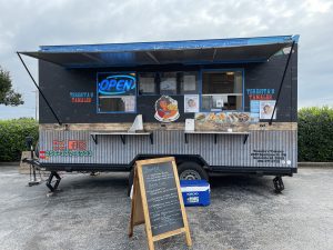 Teresita's Tamales food truck with menu board