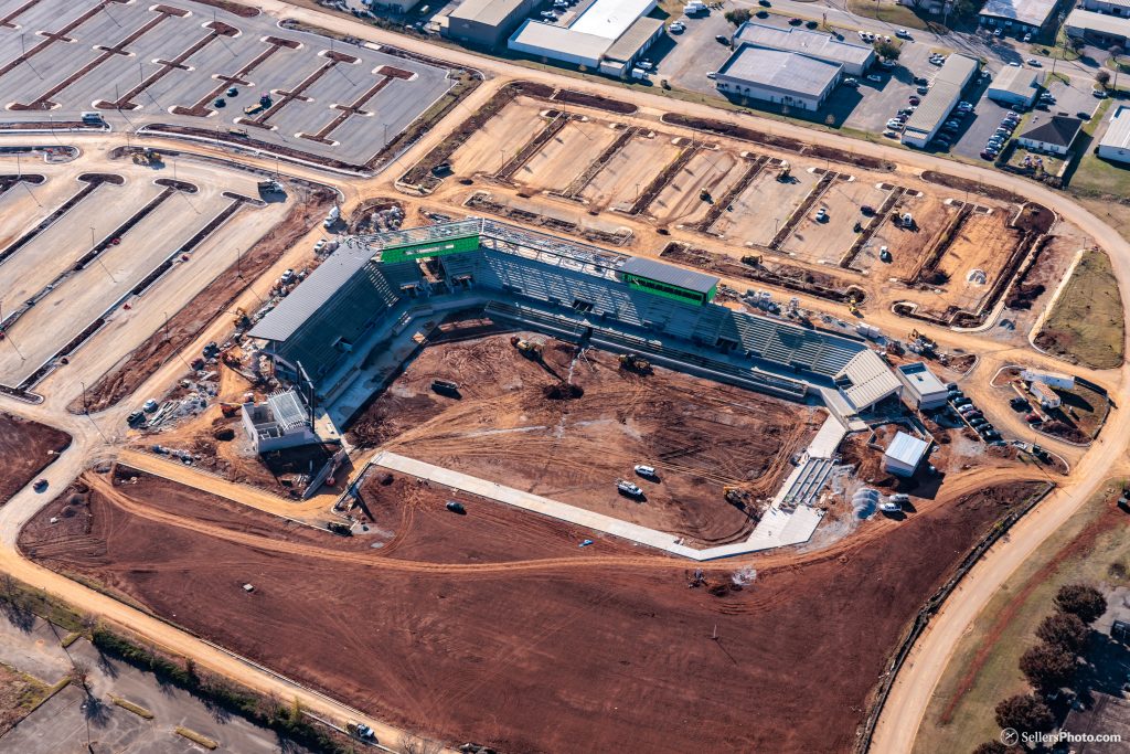 An aerial view of the construction of Joe Davis Stadium in Huntsville. There is dirt and construction vehicles also visible.