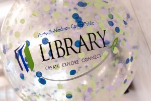 Clear library balloon with colorful confetti inside