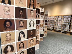 A pantone wall showcases people of all races and nationalities at "The Bias Inside Us" exhibit.