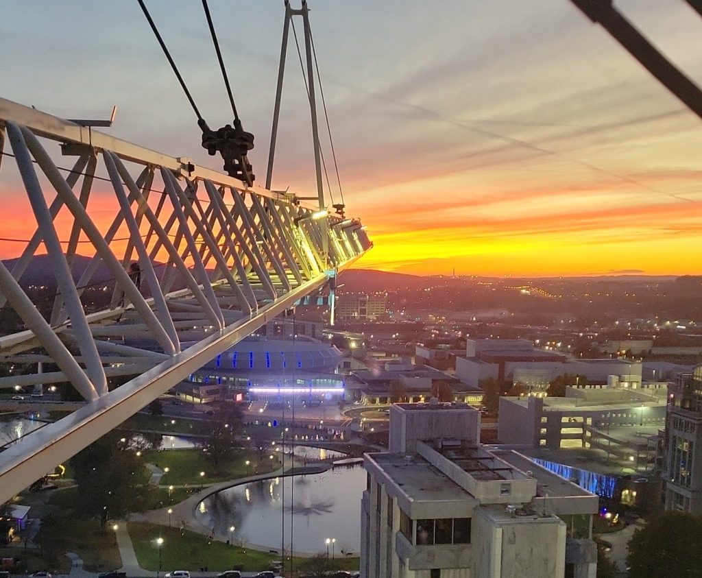 The sun sets over downtown Huntsville as captured in a photograph by crane operator Chuck Nash.