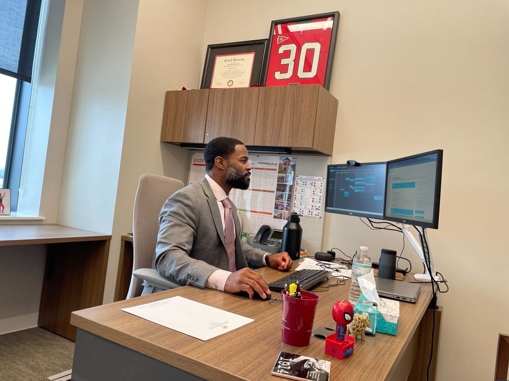 Multicultural Affairs Director Randy Barbour sits at his desk in Huntsville City Hall.