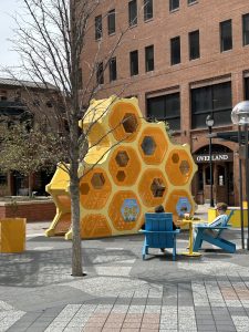 yellow pentagons stacked together as artwork