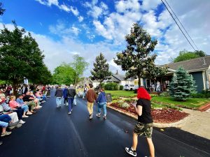 Crowds of people on Pratt Avenue gathered for PorchFest Five Points