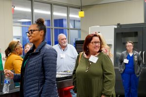 Diverse group of individuals touring the new Huntsville Center for Technology